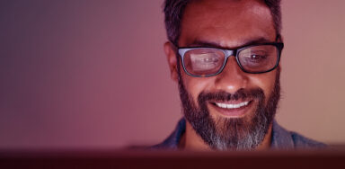 Man looking at a screen performing a SEO audit