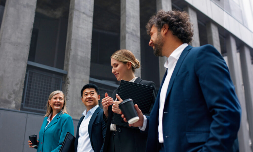 Four lawyers walking outside a legal building